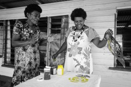 Two women screenprint a flower design onto cloth. Community Centre Conservation (C3) Fiji: Rural Entrepreneurs