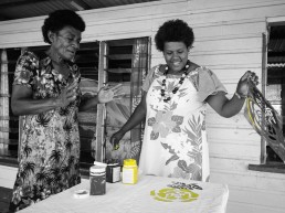 Two women screenprint a flower design onto cloth. Community Centre Conservation (C3) Fiji: Rural Entrepreneurs