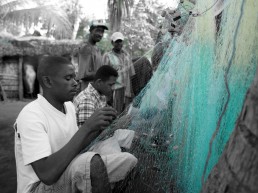 A man examines a fishing net. Community Centre Conservation (C3) Madagascar: Marine Protected Areas