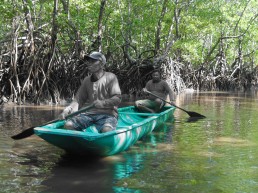 Men on a boat patrolling the mangroves. Community Centre Conservation (C3) Philippines: Blue Carbon